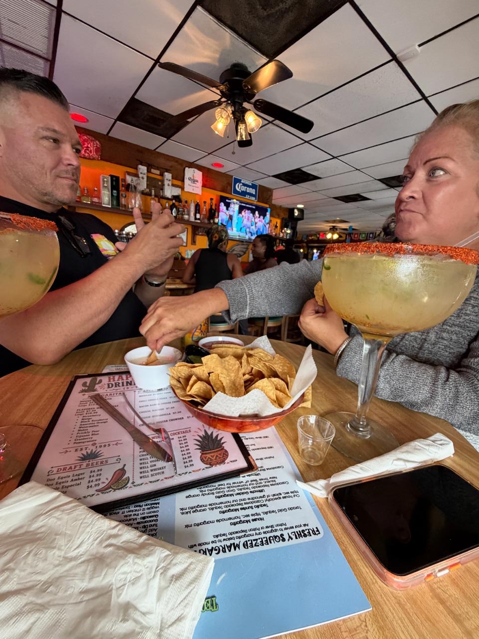 Chris and Jess challenge each other to a stare and drink contest.